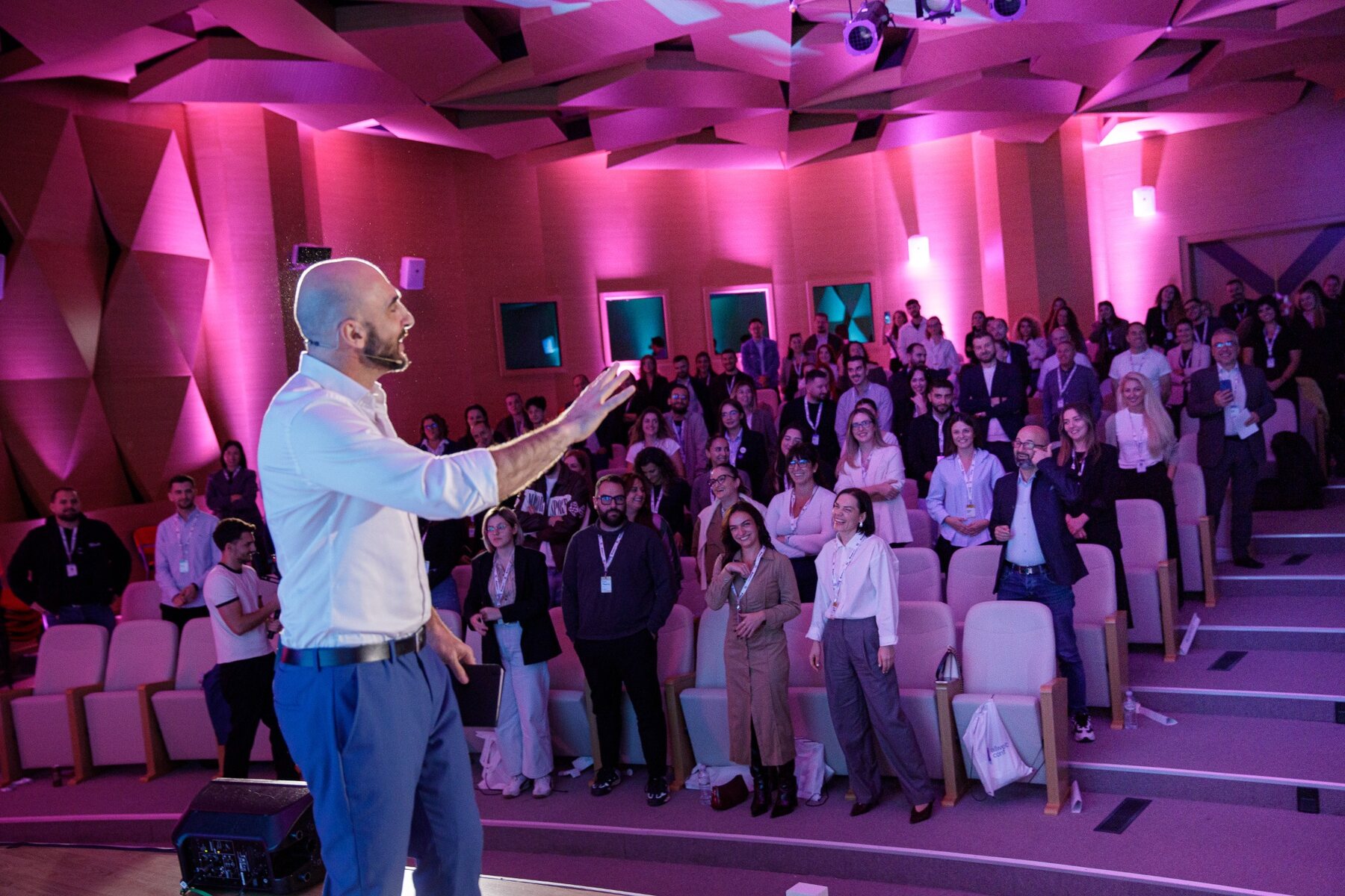 Yoad Mick engaging an audience during a keynote