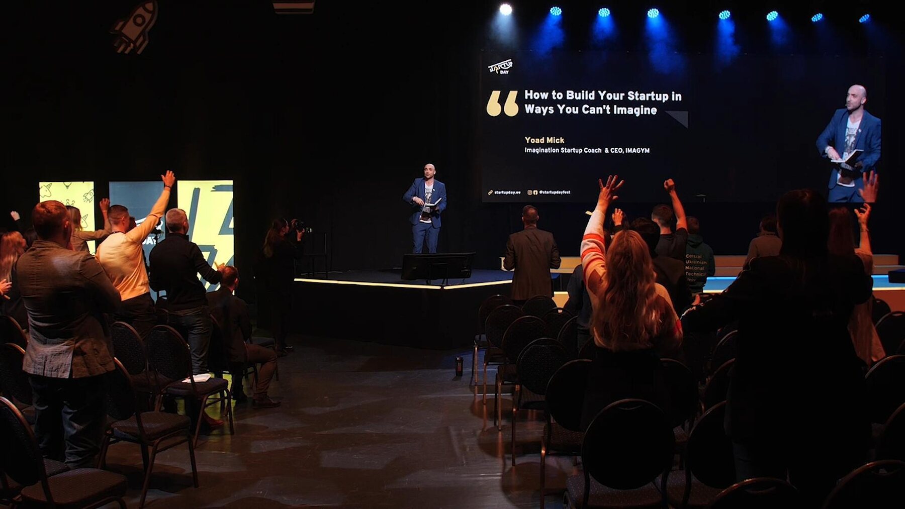 Audience participating in an IMAGYM startup keynote